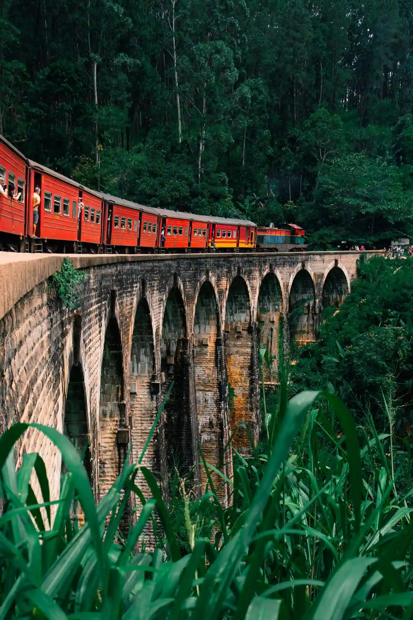 Train crossing the famous Nine Arches Bridge near Ella